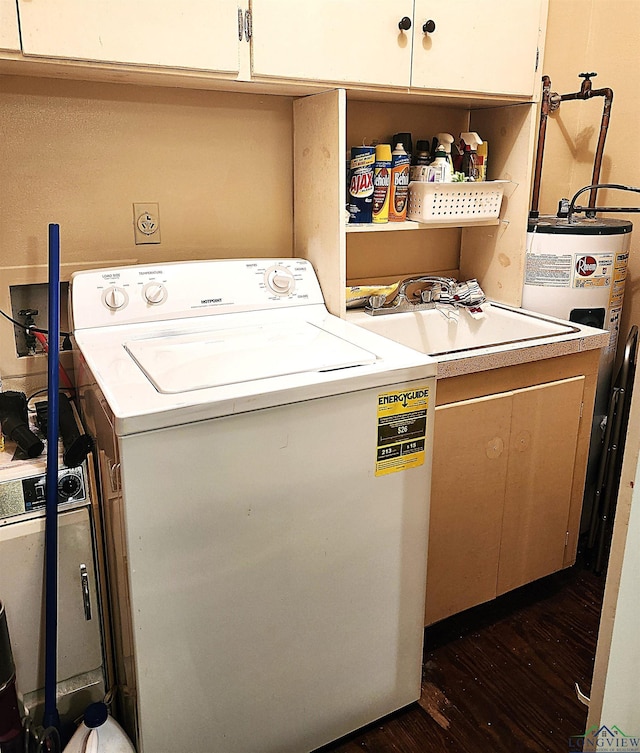 washroom featuring cabinets, dark wood-type flooring, and washer / clothes dryer