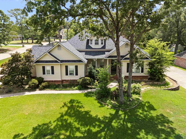 5201 Whitaker, Longview, TX 75605 - craftsman-style house featuring a shingled roof and a front lawn