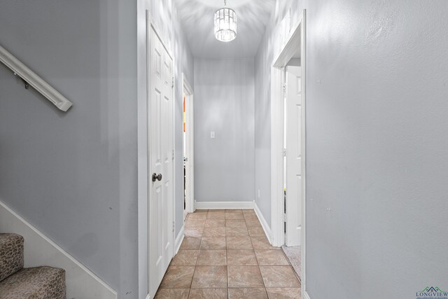 5201 Whitaker, Longview, TX 75605 - corridor featuring stairway, a chandelier, and light stone finish flooring