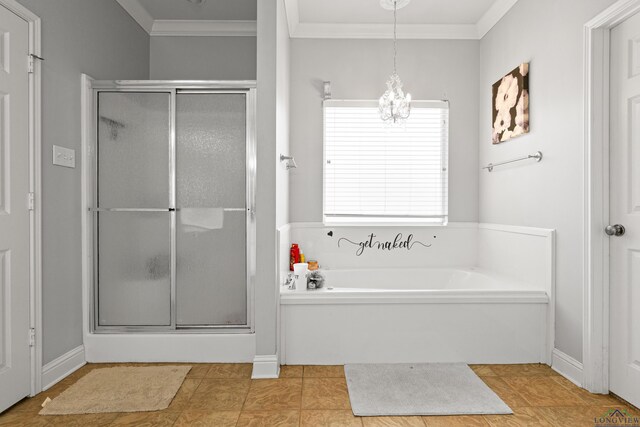 5201 Whitaker, Longview, TX 75605 - bathroom featuring a stall shower, a chandelier, a garden tub, ornamental molding, and tile patterned floors