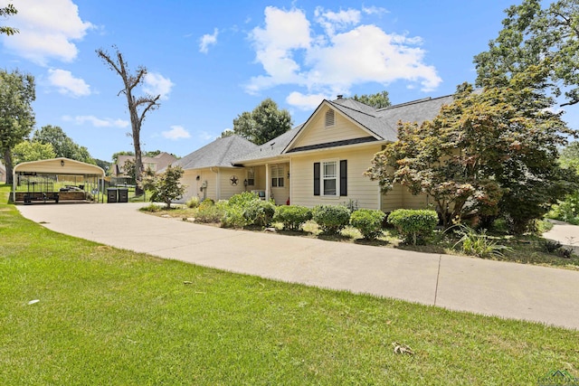 5201 Whitaker, Longview, TX 75605 - view of front of house featuring a front lawn and a carport