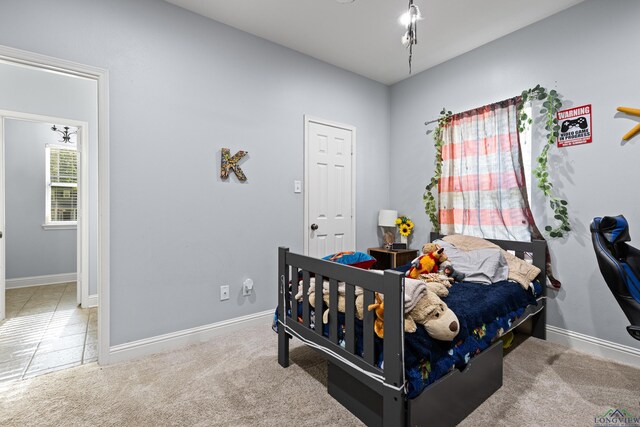 5201 Whitaker, Longview, TX 75605 - carpeted bedroom with baseboards and tile patterned flooring
