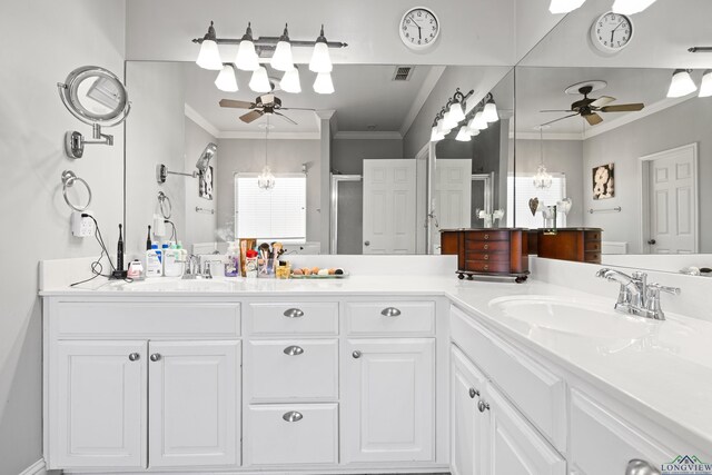 5201 Whitaker, Longview, TX 75605 - bathroom with a ceiling fan, a shower stall, double vanity, and crown molding