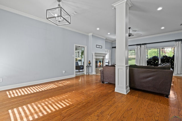 5201 Whitaker, Longview, TX 75605 - living area with crown molding, ornate columns, wood finished floors, recessed lighting, and a chandelier