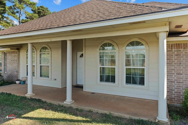 doorway to property featuring covered porch