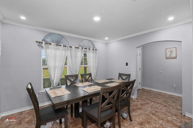 dining room featuring tile patterned flooring and ornamental molding