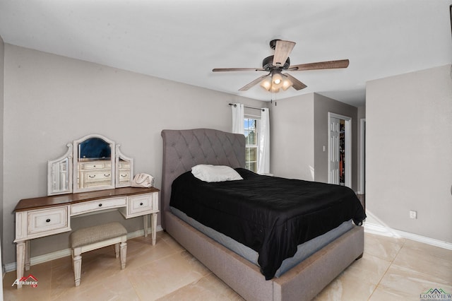 tiled bedroom with ceiling fan and a closet