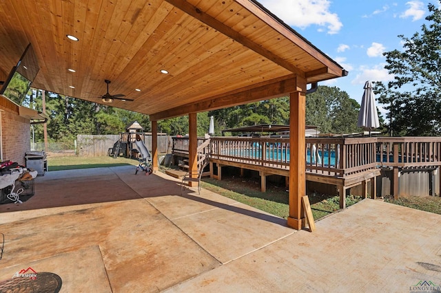 view of patio featuring a swimming pool side deck and ceiling fan