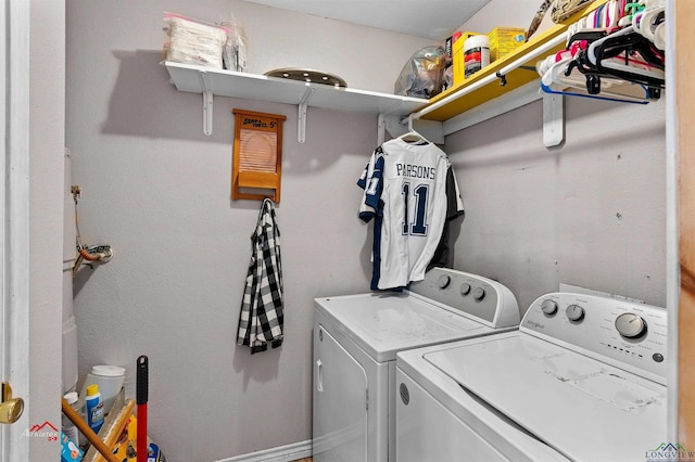 washroom with washing machine and clothes dryer