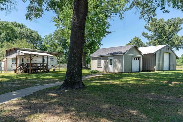 exterior space with fence, an outdoor structure, and a garage
