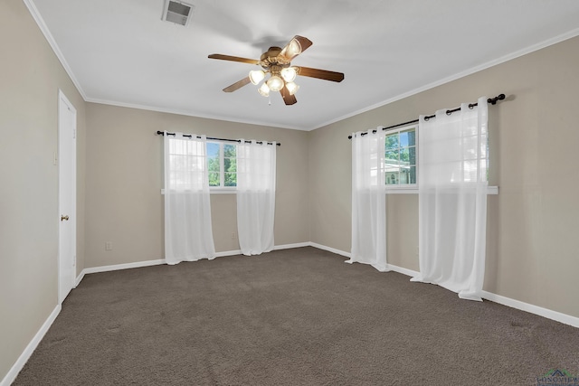 empty room with a ceiling fan, crown molding, visible vents, and plenty of natural light