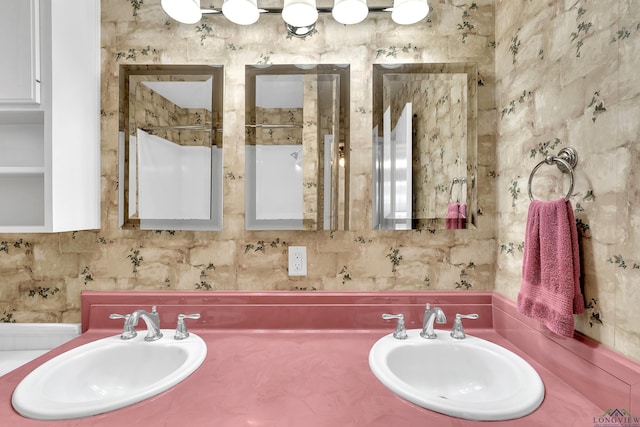 bathroom featuring tasteful backsplash and a sink