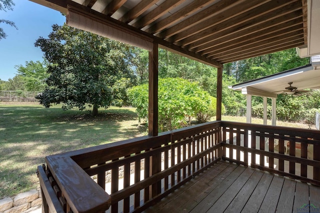 deck featuring a yard and a ceiling fan