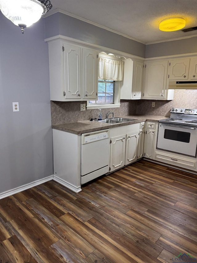 909 Stewart St, Atlanta, TX 75551 - kitchen featuring white appliances, white cabinetry, dark wood-style flooring, tasteful backsplash, and crown molding