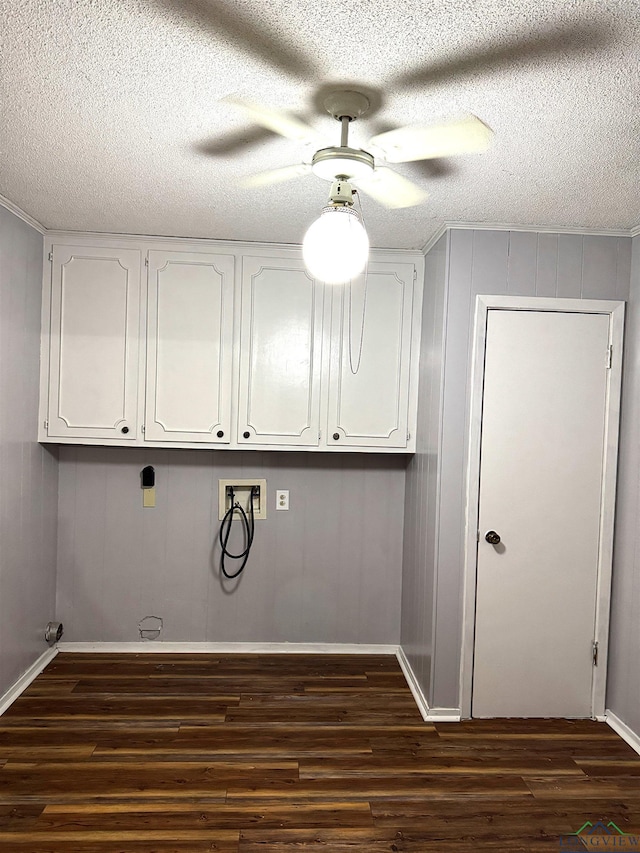 909 Stewart St, Atlanta, TX 75551 - laundry room featuring hookup for a washing machine, cabinet space, dark wood-style floors, ceiling fan, and a textured ceiling