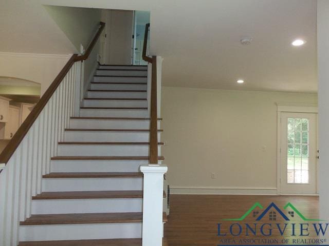 staircase featuring hardwood / wood-style flooring