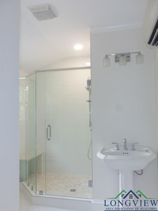 bathroom featuring an enclosed shower