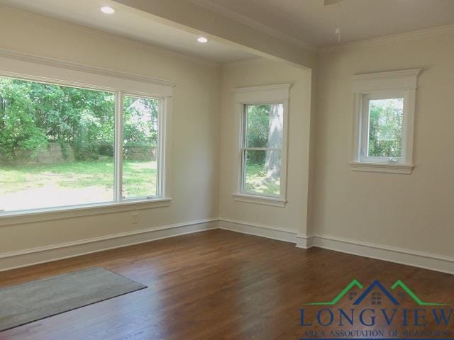 unfurnished room with dark hardwood / wood-style floors and ornamental molding