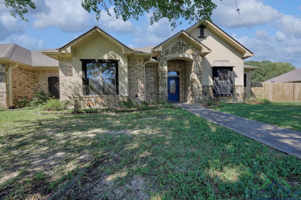 view of front of house with a front lawn