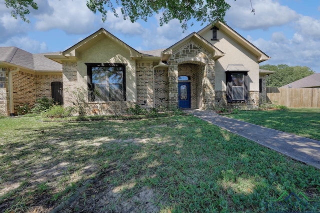 view of front of house with a front lawn