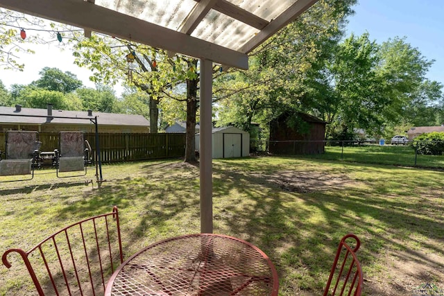 view of yard featuring a fenced backyard, an outdoor structure, and a shed