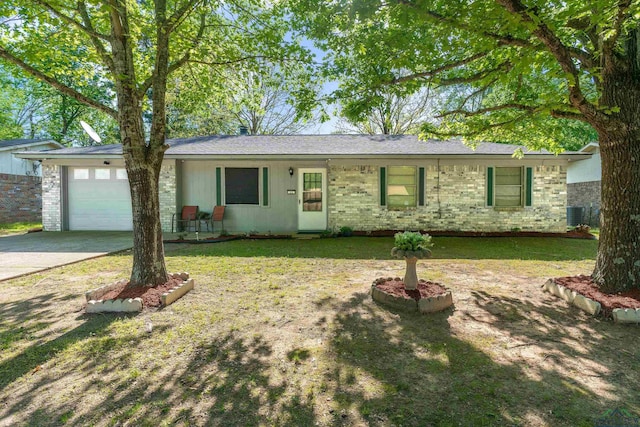 ranch-style home with a front lawn, driveway, brick siding, and a garage