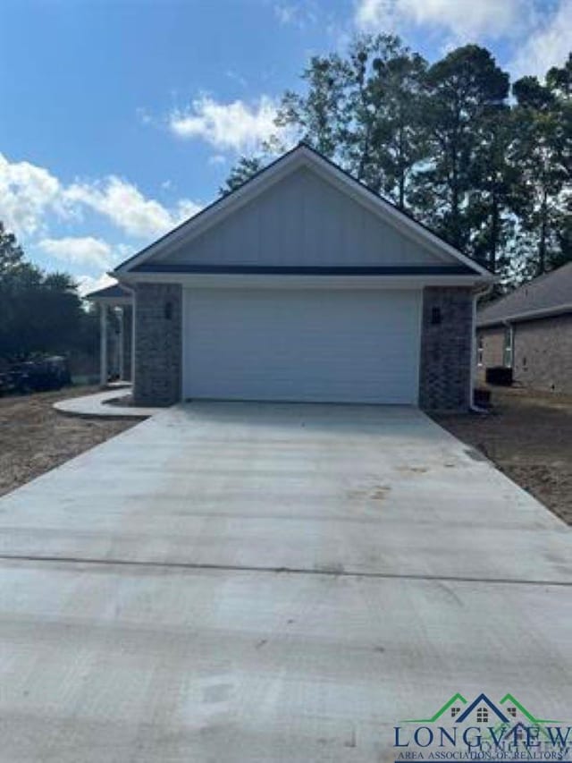 204 Alma St, Longview, TX 75605 - view of front facade with concrete driveway and an attached garage