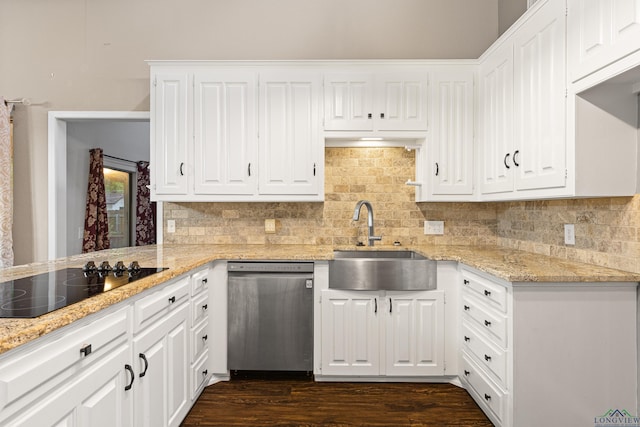 kitchen featuring white cabinets, black electric stovetop, sink, stainless steel dishwasher, and light stone countertops