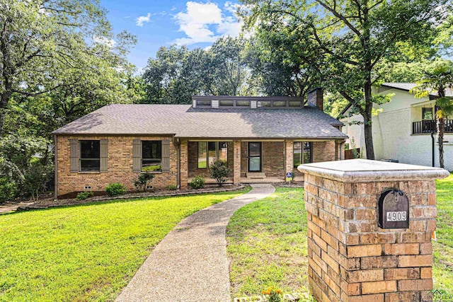 ranch-style house with a front lawn