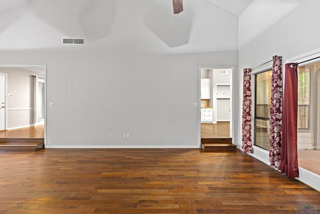 unfurnished room featuring dark hardwood / wood-style floors, ceiling fan, and lofted ceiling