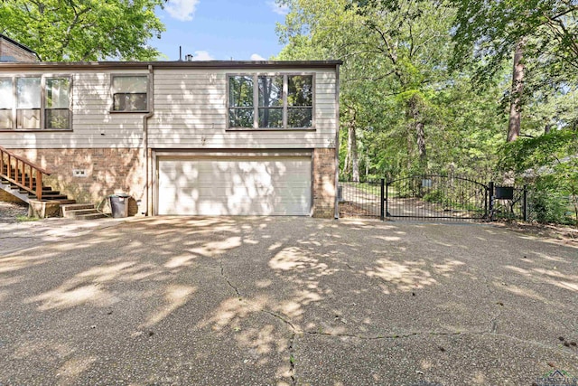 view of side of home featuring a garage