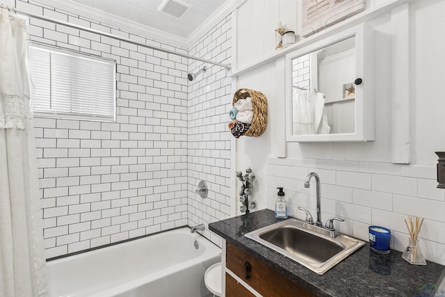 bathroom featuring tile walls, backsplash, vanity, crown molding, and shower / bathtub combination with curtain