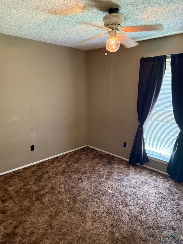 206 Syble Ln, Longview, TX 75605 - carpeted spare room featuring a ceiling fan and a textured ceiling