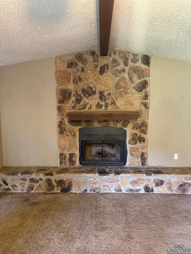 206 Syble Ln, Longview, TX 75605 - detailed view of beamed ceiling, carpet flooring, a fireplace, and a textured ceiling