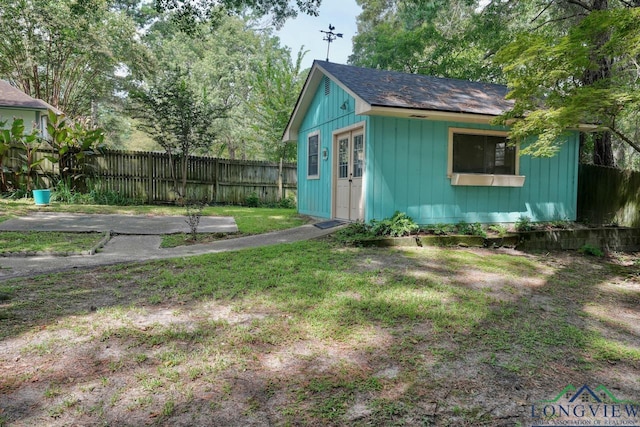 view of outbuilding featuring a yard