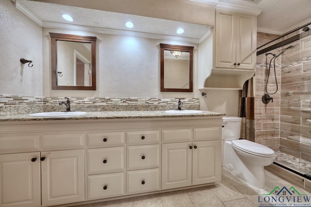 bathroom with vanity, ornamental molding, walk in shower, toilet, and a textured ceiling