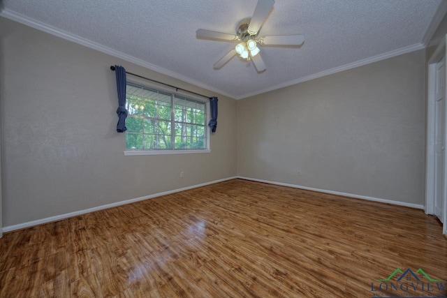 spare room featuring hardwood / wood-style flooring, ornamental molding, ceiling fan, and a textured ceiling