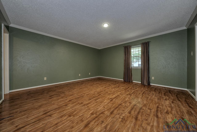 spare room with wood-type flooring, ornamental molding, and a textured ceiling