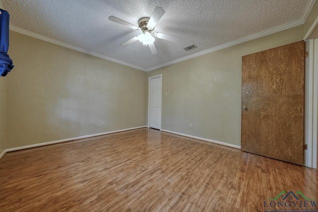 unfurnished bedroom with ceiling fan, crown molding, light hardwood / wood-style flooring, and a textured ceiling