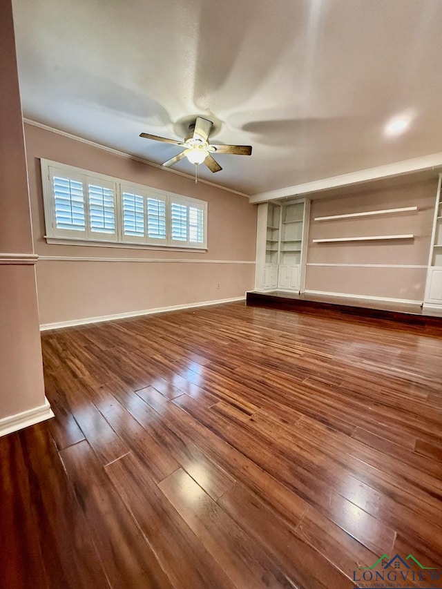 unfurnished bedroom featuring multiple windows, ceiling fan, crown molding, and dark wood-type flooring