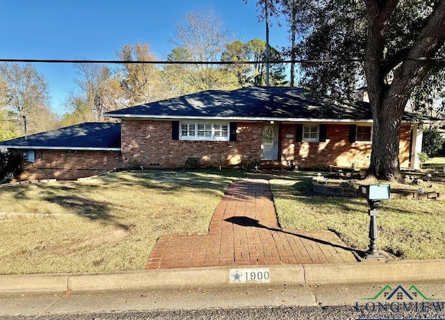 ranch-style home with a front yard