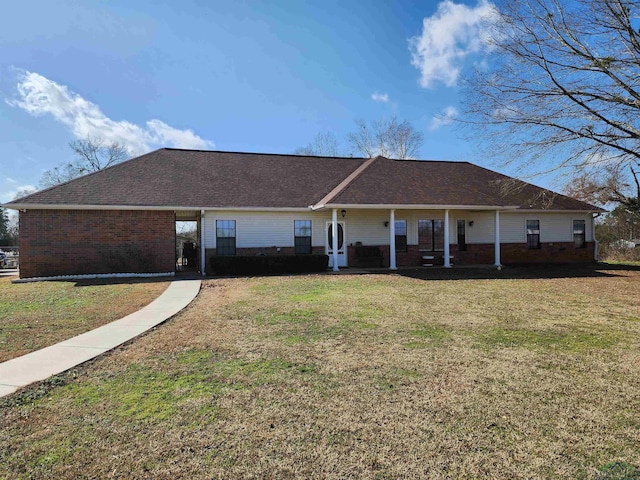 ranch-style home with a front yard and covered porch