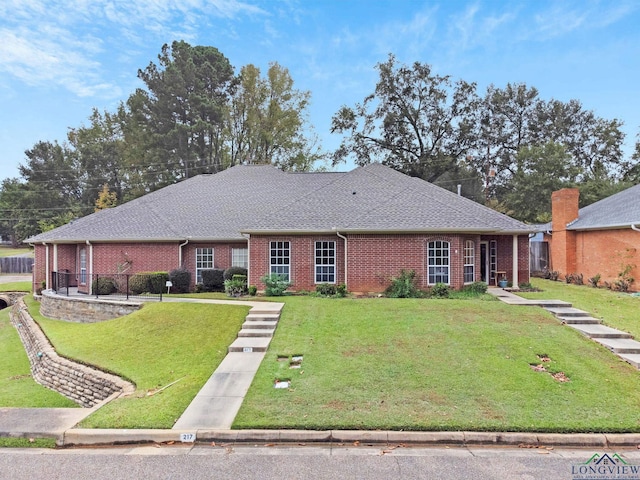 ranch-style house with a front lawn