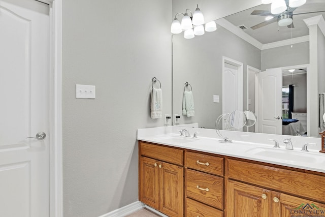 bathroom featuring vanity, ceiling fan, and ornamental molding