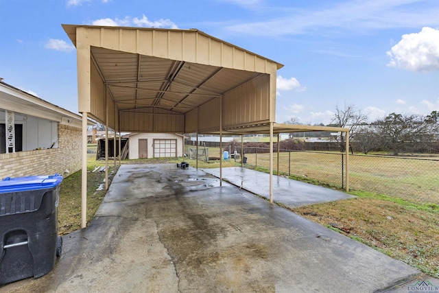 view of parking / parking lot with a carport and a lawn