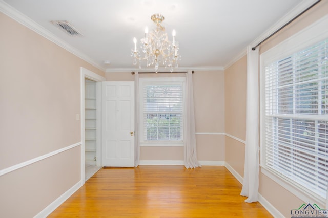 15 Rockwall Dr, Longview, TX 75604 - unfurnished room featuring a chandelier, light wood finished floors, and ornamental molding