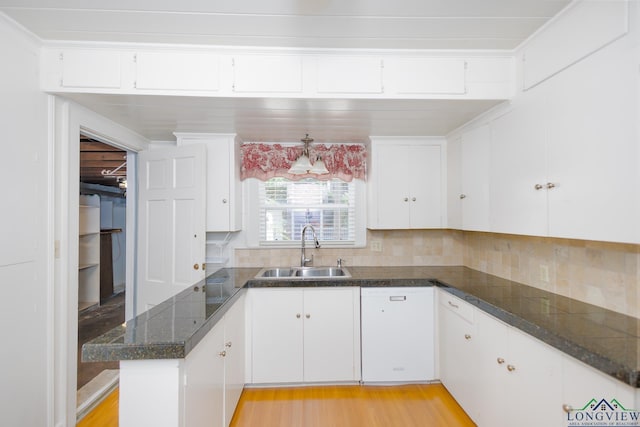 15 Rockwall Dr, Longview, TX 75604 - kitchen with white cabinetry, decorative backsplash, a peninsula, and tile countertops