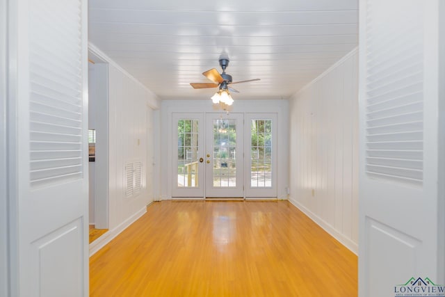15 Rockwall Dr, Longview, TX 75604 - spare room featuring french doors, light wood finished floors, ornamental molding, and ceiling fan
