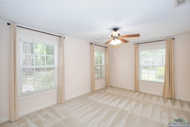 15 Rockwall Dr, Longview, TX 75604 - carpeted spare room with a ceiling fan and baseboards
