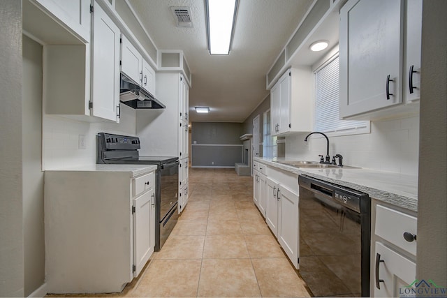 kitchen featuring backsplash, sink, black appliances, light tile patterned floors, and white cabinetry